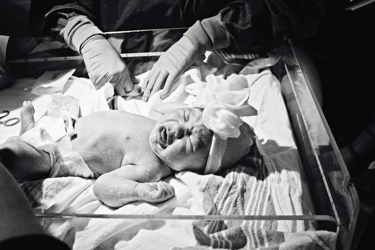 Newborn crying after her birth