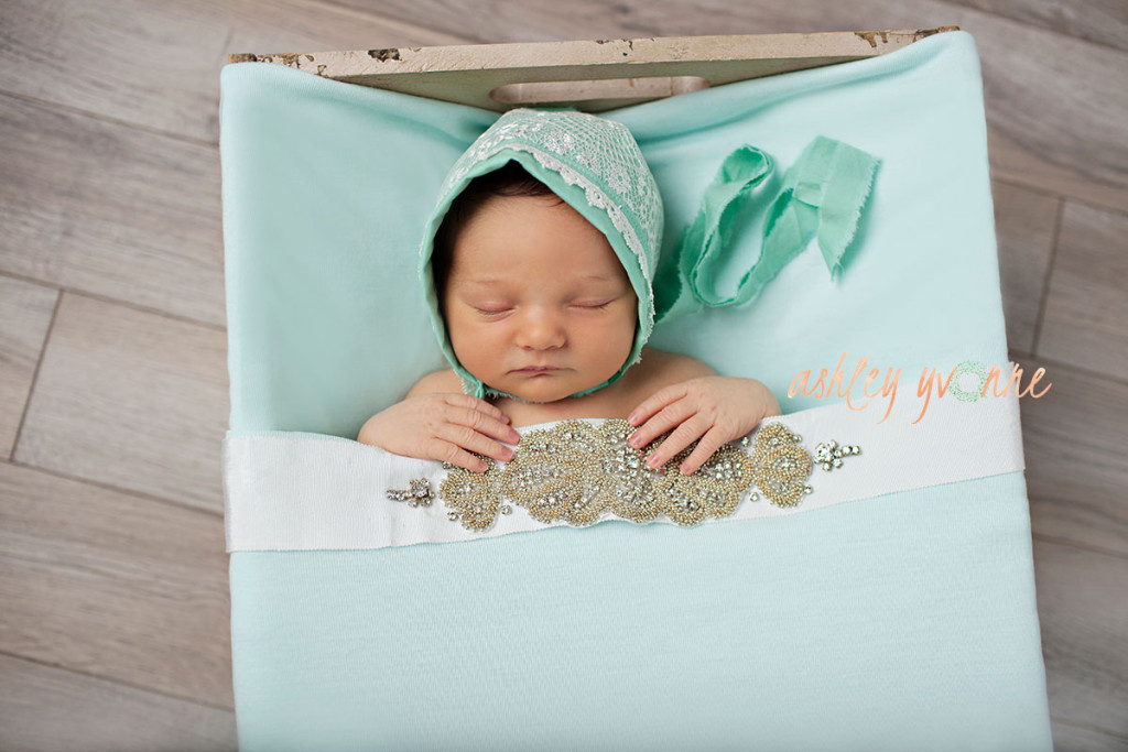 infant in blue bed 