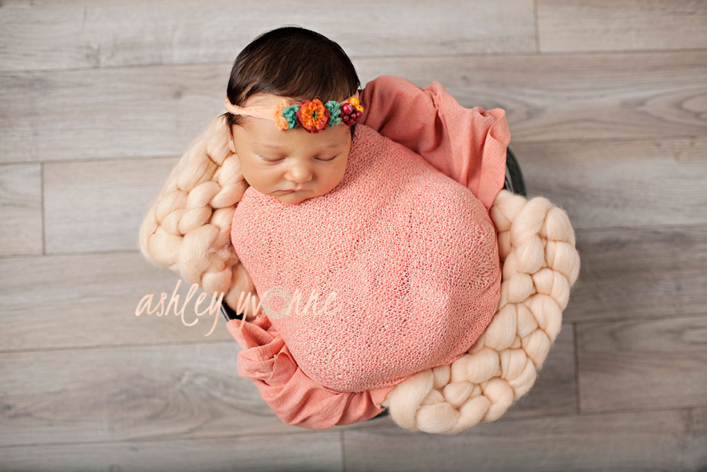 peach bucket with newborn girl