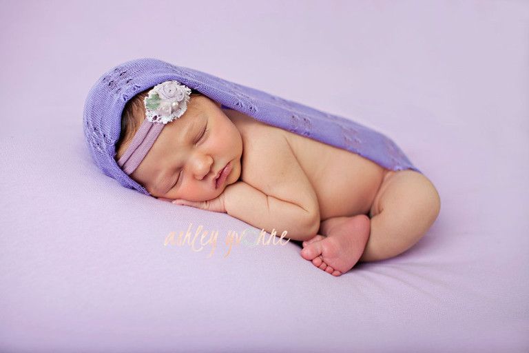 newborn girl in purple