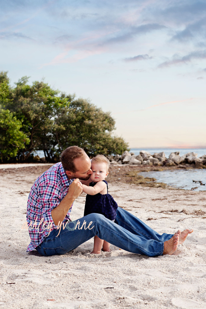 dad kissing daughter