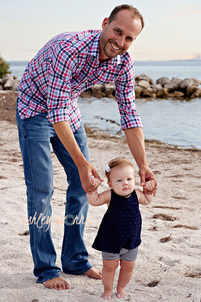 dad holding little girl