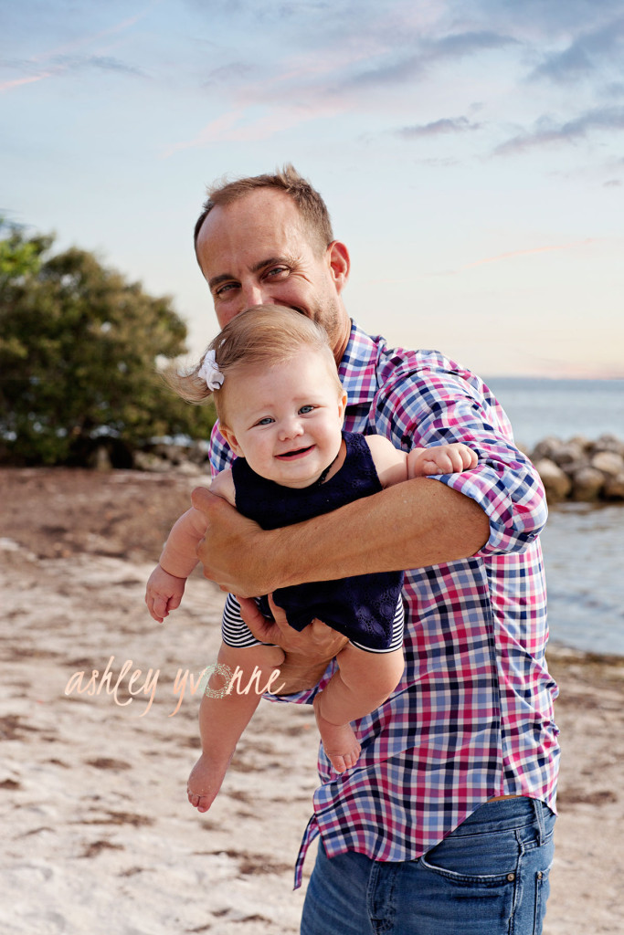 dad holding daughter